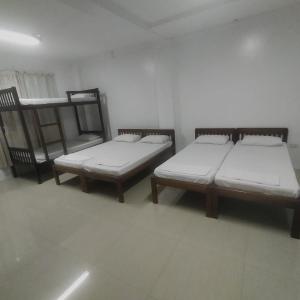 Giường trong phòng chung tại EL SEÑOR JESUS APARTELLE