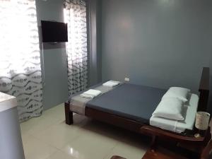 Een bed of bedden in een kamer bij EL SEÑOR JESUS APARTELLE