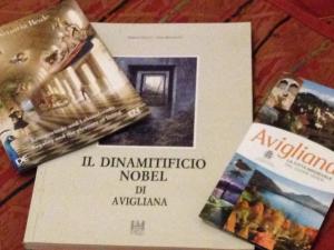 a book with a picture of a building on it at Caprice in Avigliana