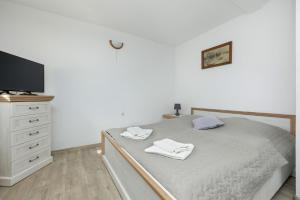 Postel nebo postele na pokoji v ubytování Older Krab