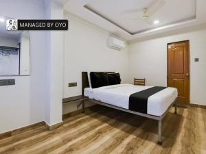En eller flere senge i et værelse på Super Collection O Dabolim Near Goa International Airport