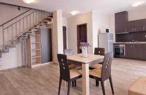 Kuchyň nebo kuchyňský kout v ubytování Sorento Sole Mare Apartments