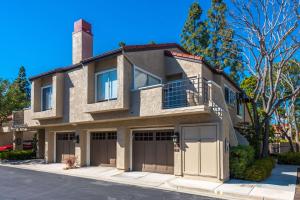 a house with two garages and a garage at Cozy UCI Townhome 2 Bedroom 2 Bath in Irvine