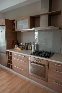 a kitchen with a stove and a refrigerator at Nice&cozy flat No7 in Rīga