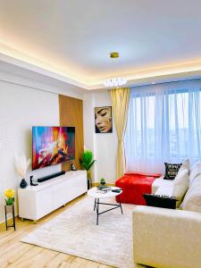 โทรทัศน์และ/หรือระบบความบันเทิงของ Elite 1 bedroom, westlands