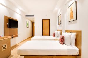 Lemon Tree Hotel Chandigarh客房内的一张或多张床位
