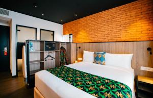 Voodi või voodid majutusasutuse ONOMO Hotel Kampala toas
