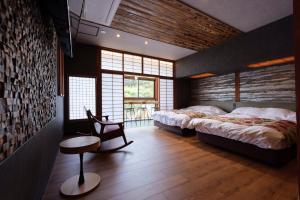 Voodi või voodid majutusasutuse Arifuku Onsen Yoshidaya toas