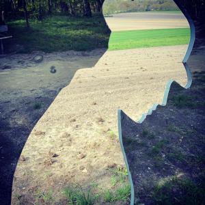 a stairway leading into a park with a field at FeWo Hasen Suite in Worpswede