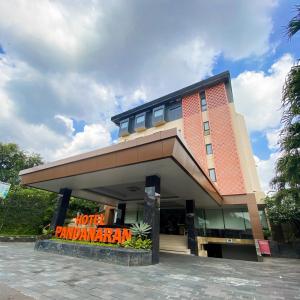 a building with a sign in front of it at Pandanaran Prawirotaman Yogyakarta in Yogyakarta