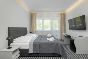 Posteľ alebo postele v izbe v ubytovaní Aparthotel Etna