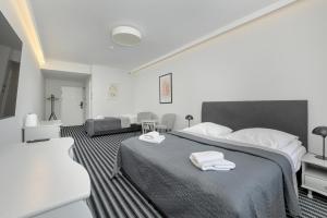 Posteľ alebo postele v izbe v ubytovaní Aparthotel Etna
