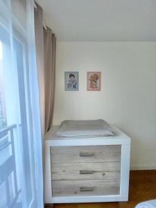 a bedroom with a white dresser with a drawer at Sweet Escape Paris Centre - 3 bds- terrasse - Stade de France - Montmartre in Saint-Ouen