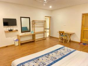 Postel nebo postele na pokoji v ubytování Hotel Palam Hills