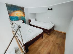 Postel nebo postele na pokoji v ubytování Central Sopot