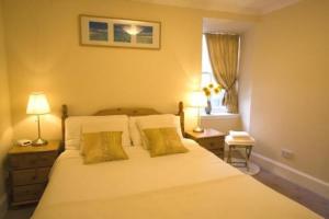 Postel nebo postele na pokoji v ubytování Apartments Royal