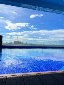a swimming pool with a view of the sky at Casa Luna Unit 1 in Manila