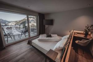 Posteľ alebo postele v izbe v ubytovaní Hotel Continental Dolomites