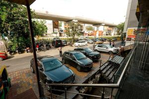 a group of cars parked in a parking lot at Dazzling in Agra