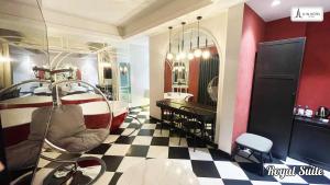 a salon with a barber chair and a checkerboard floor at A In Hotel Atistar in Ho Chi Minh City