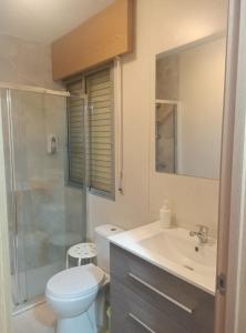 a bathroom with a toilet and a sink and a shower at Pilgrim Rooms in Redondela +41 photos