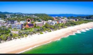 an aerial view of a beach with buildings and the ocean at Beachside Serenity - 100m to Beach in Nelson Bay