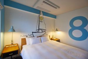 Postel nebo postele na pokoji v ubytování 8 Hotel Shonan Fujisawa