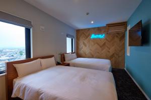 Postel nebo postele na pokoji v ubytování 8 Hotel Shonan Fujisawa