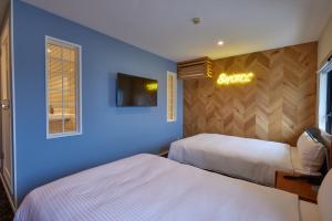 Postel nebo postele na pokoji v ubytování 8 Hotel Shonan Fujisawa
