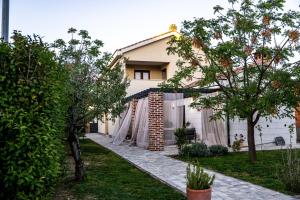 a house with a fence in front of it at House "Mediterrian spirit" with jacuzzi in Zadar in Zadar