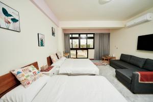 Postel nebo postele na pokoji v ubytování 文青逸宿 + 38 fotografií