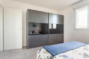 Voodi või voodid majutusasutuse casa MEV è un attico in centro a Fiume Veneto toas