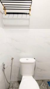a bathroom with a white toilet in a room at Paddy Villea with 5 Bedrooms Penang in Permatang Pauh