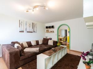 a living room with a couch and a table at Special Apartment in Walchen with Private Terrace in Piesendorf