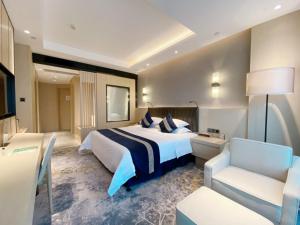 Voodi või voodid majutusasutuse Chongqing Liyuan Hotel toas
