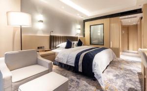 Voodi või voodid majutusasutuse Chongqing Liyuan Hotel toas