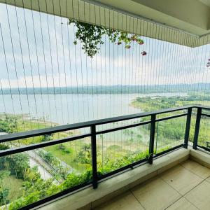a balcony with a view of the water at Seaview 2B1R 5pax Condo Forest City 1G-1608 in Gelang Patah +6 photos