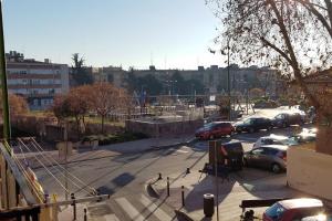 a parking lot with parked cars in a city at Céntrico apartamento bien ubicado para 5, 3 Hab in Alcobendas