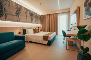 a hotel room with a bed and a desk at Lumia Hotel in Termoli +120 photos