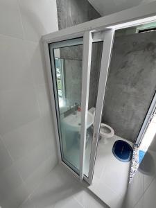 a bathroom with a sink and a toilet at Supreme Siam Resort in Koh Samui 