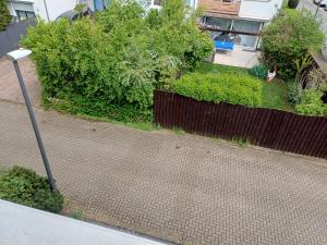 a street light on a sidewalk next to a yard at B&B Koeln Zuendorf in Cologne