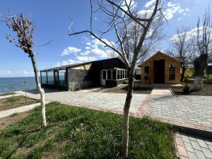 a house on the shore of the water at Anabella Sevan - Коттеджи рядом с озером Севан (Sevanavanq) in Sevan
