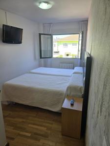 Cama o camas de una habitación en Noja Rooms