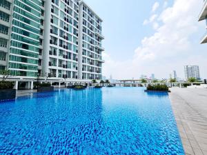 a large swimming pool in front of a building at Garden Duplex Studio 7 Guest Old Klang Road Kuala Lumpur Mid Valley Pearl Point Bangsar Bangsar South Bukit Jalil Taman Desa ML in Kuala Lumpur