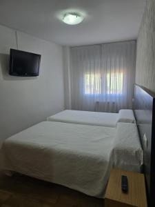 Cama o camas de una habitación en Noja Rooms