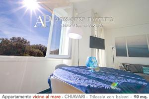 a room with a bed with a window and a table at Dolce Mare in Chiavari
