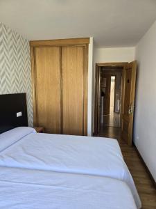 Cama o camas de una habitación en Noja Rooms