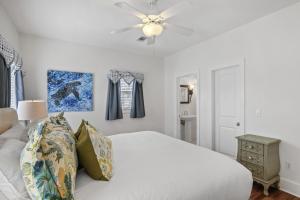 a bedroom with a white bed and a ceiling fan at My Blue Heaven in Rosemary Beach +48 photos