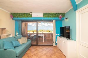 Et tv og/eller underholdning på Appartamento Golfo Marinella