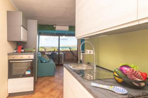 Køkken eller tekøkken på Appartamento Golfo Marinella